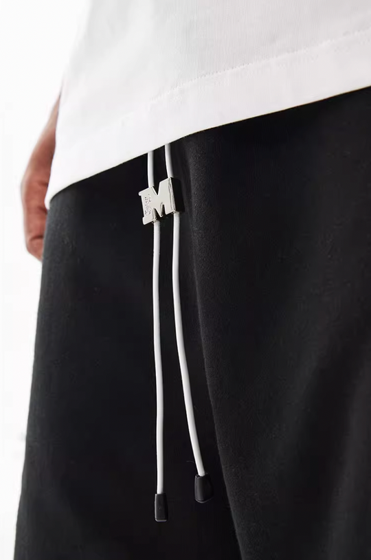 MEDM M Buckle Cut Off Shorts