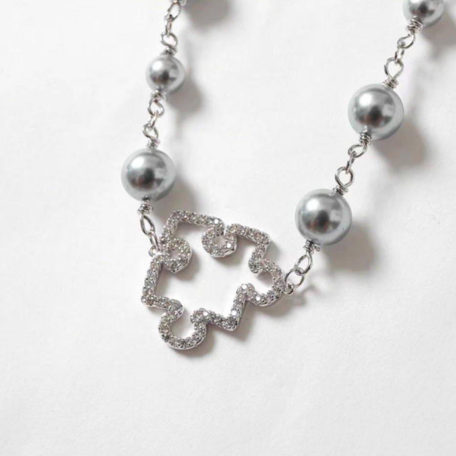 YADcrew Puzzle Pearl Necklace | Face 3 Face