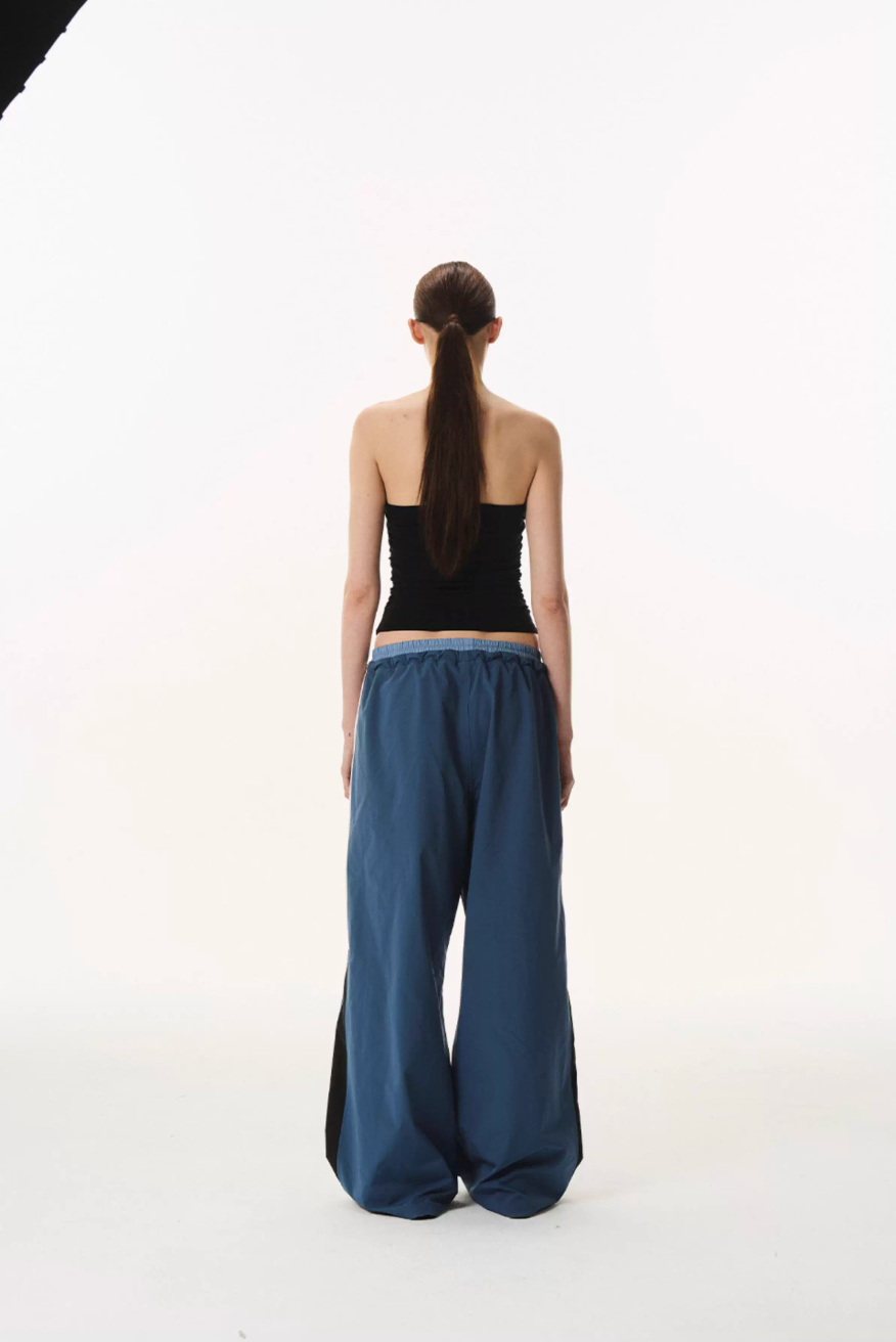 BLIND NO PLAN Double Waist Layered Color Block Pleated Track Pants | Face 3 Face