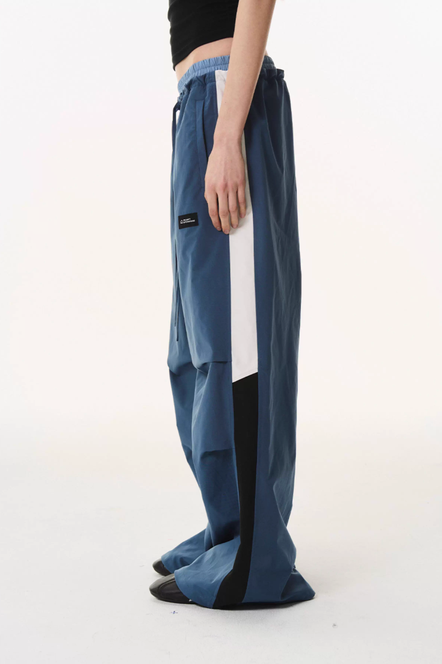 BLIND NO PLAN Double Waist Layered Color Block Pleated Track Pants | Face 3 Face