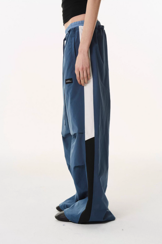 BLIND NO PLAN Double Waist Layered Color Block Pleated Track Pants | Face 3 Face