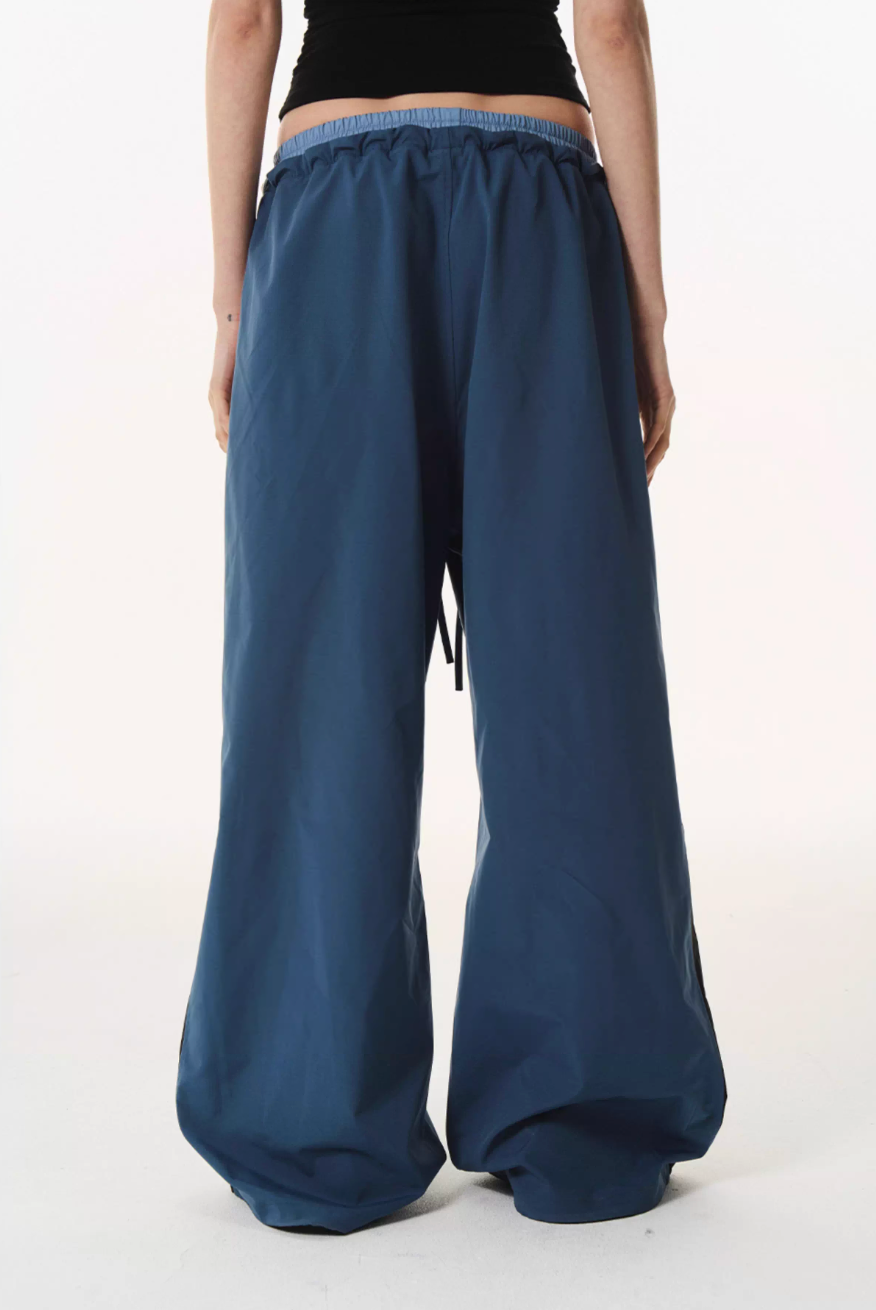 BLIND NO PLAN Double Waist Layered Color Block Pleated Track Pants | Face 3 Face
