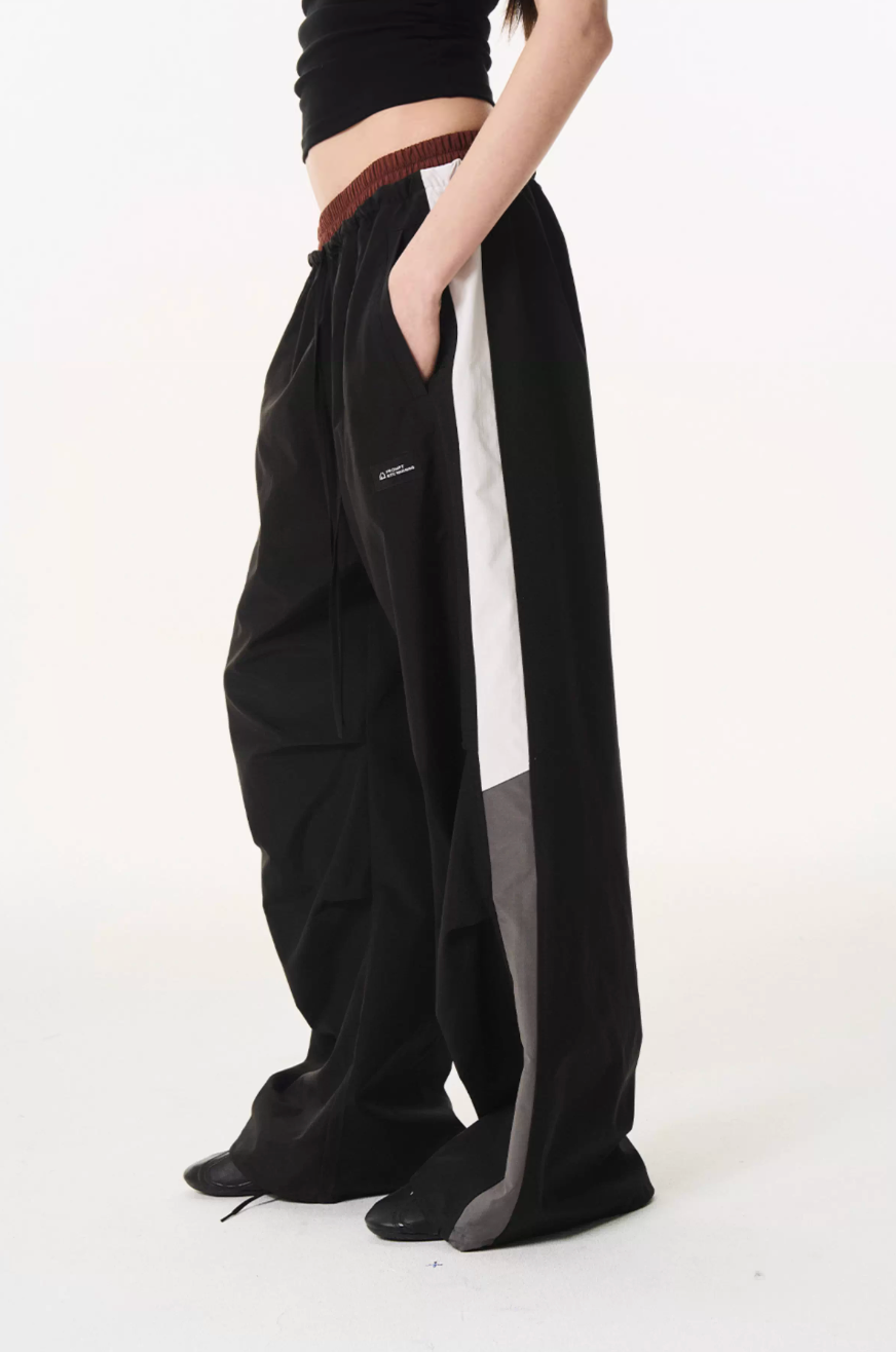BLIND NO PLAN Double Waist Layered Color Block Pleated Track Pants | Face 3 Face
