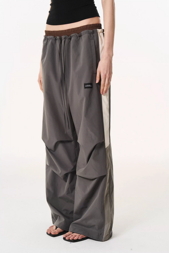 BLIND NO PLAN Double Waist Layered Color Block Pleated Track Pants | Face 3 Face