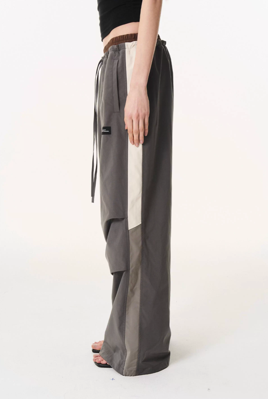 BLIND NO PLAN Double Waist Layered Color Block Pleated Track Pants | Face 3 Face