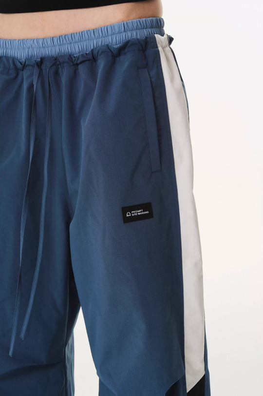 BLIND NO PLAN Double Waist Layered Color Block Pleated Track Pants | Face 3 Face