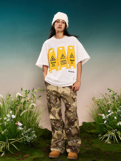 YADcrew “Love Caution Seal” Print Tee | Face 3 Face