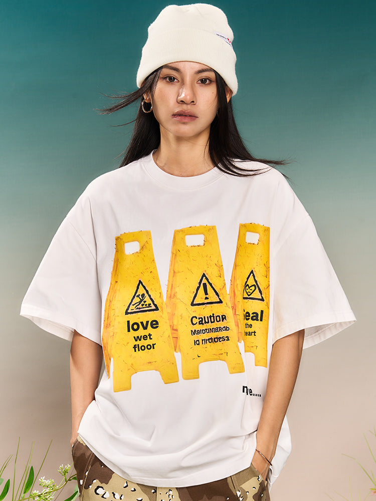 YADcrew “Love Caution Seal” Print Tee | Face 3 Face