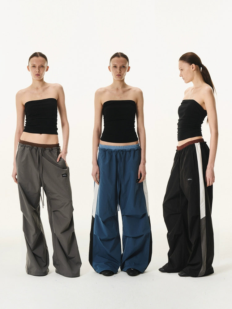 BLIND NO PLAN Double Waist Layered Color Block Pleated Track Pants | Face 3 Face