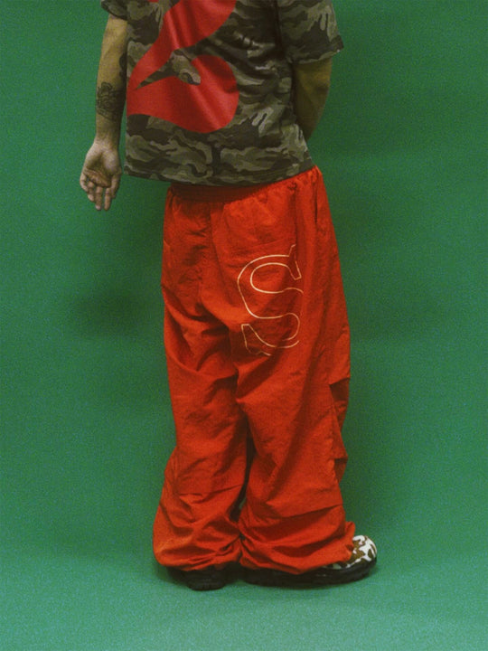 EVETS Orange Logo Print Nylon Baggy Track Pants | Face 3 Face