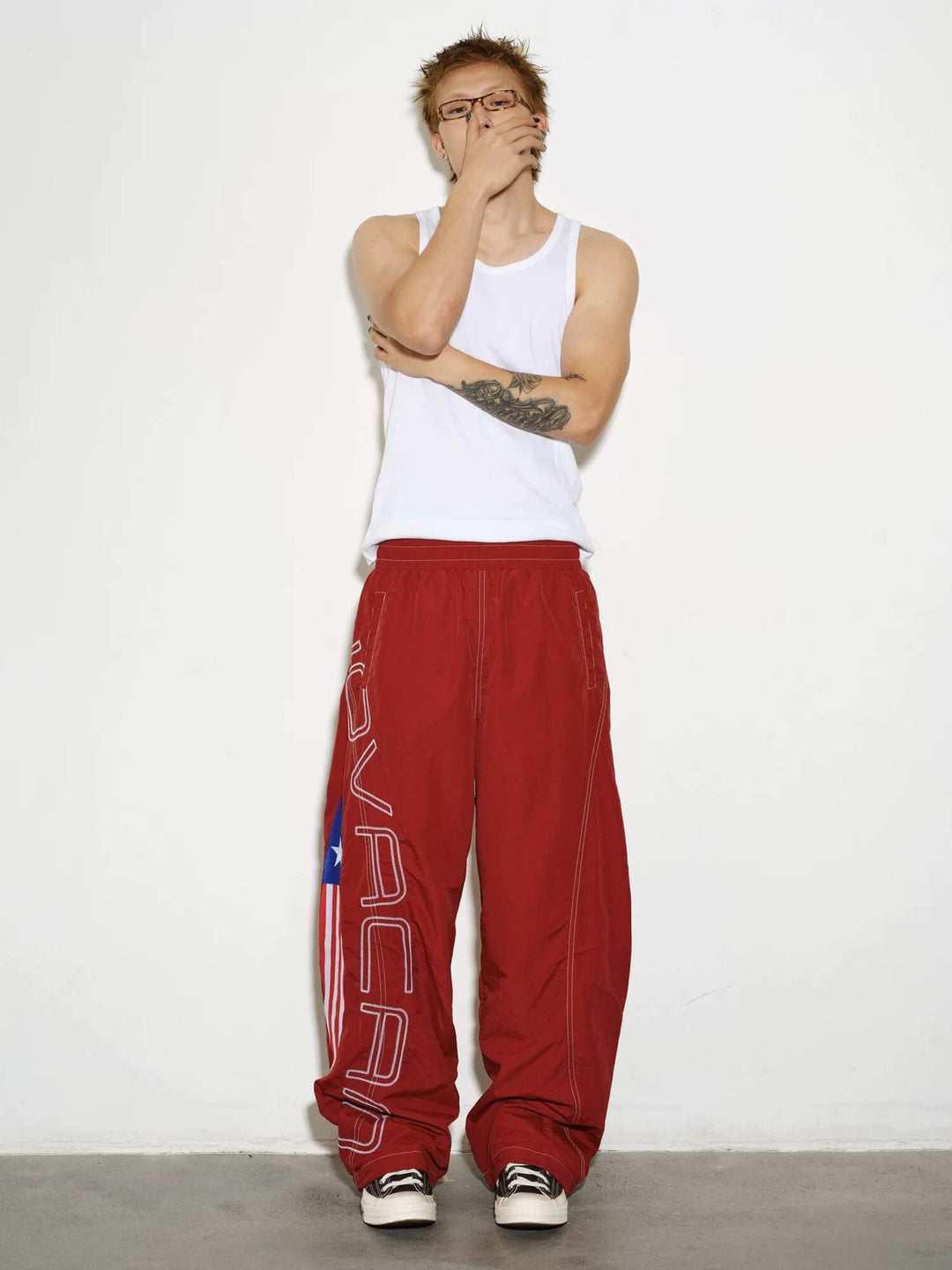 NOVACAM Logo Embroidered Nylon Curved Baggy Track Pants | Face 3 Face