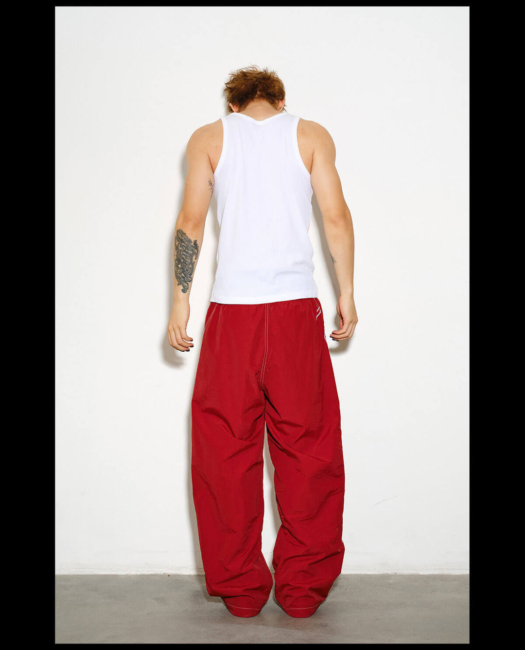 NOVACAM Logo Embroidered Nylon Curved Baggy Track Pants | Face 3 Face