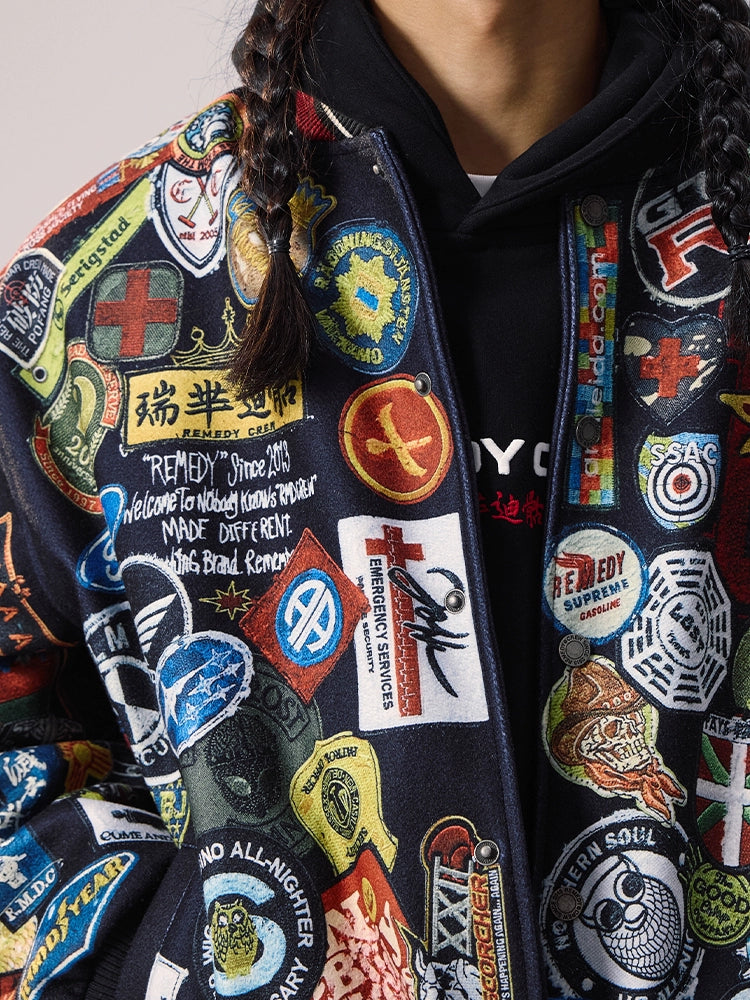 Remedy All Over Badge Print Varsity Jacket | Face 3 Face