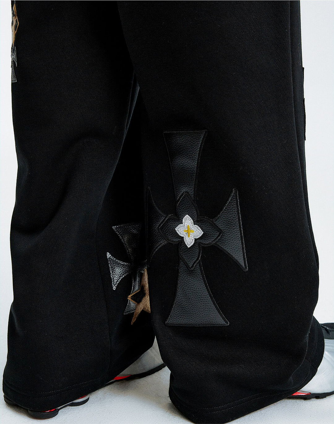 MEDM Leather Cross Star Patchwork Sweatpants | Face 3 Face