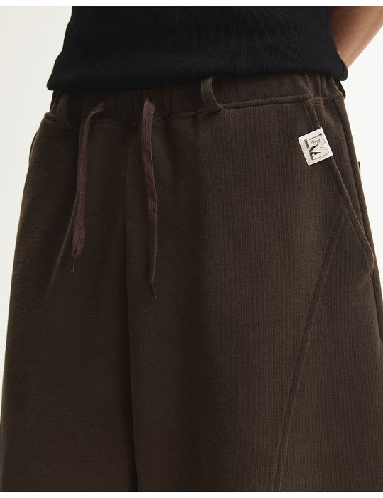 MEDM Curved Metal Tag Baggy Sweatpants | Face 3 Face