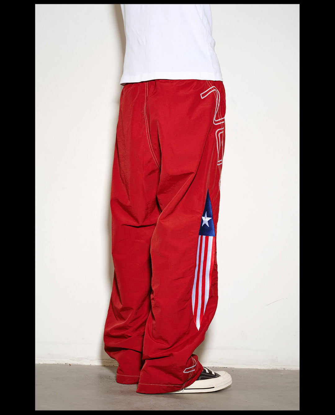 NOVACAM Logo Embroidered Nylon Curved Baggy Track Pants | Face 3 Face