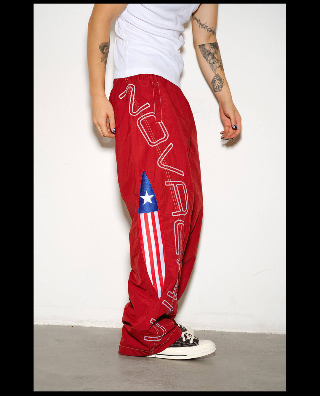 NOVACAM Logo Embroidered Nylon Curved Baggy Track Pants | Face 3 Face