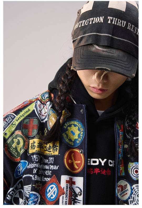 Remedy All Over Badge Print Varsity Jacket | Face 3 Face
