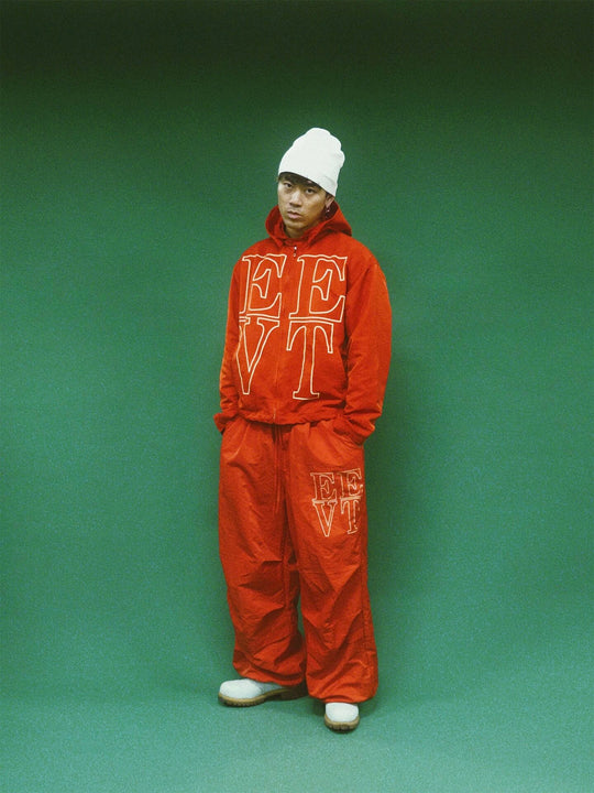 EVETS Orange Logo Print Nylon Baggy Track Pants | Face 3 Face