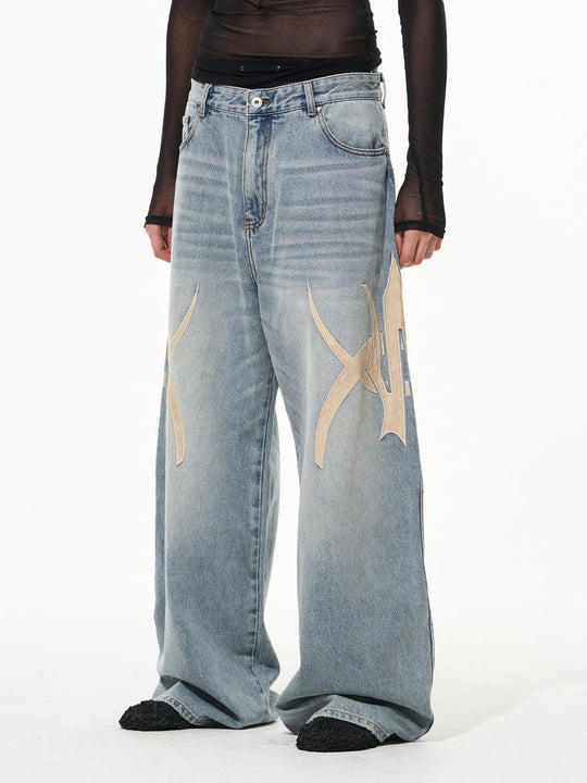 BLIND NO PLAN Graphic Logo Leather-Embroidered Washed Baggy Jeans | Face 3 Face