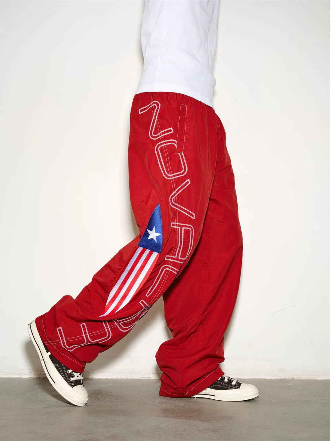 NOVACAM Logo Embroidered Nylon Curved Baggy Track Pants | Face 3 Face