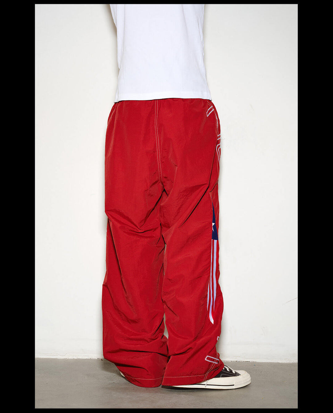NOVACAM Logo Embroidered Nylon Curved Baggy Track Pants | Face 3 Face