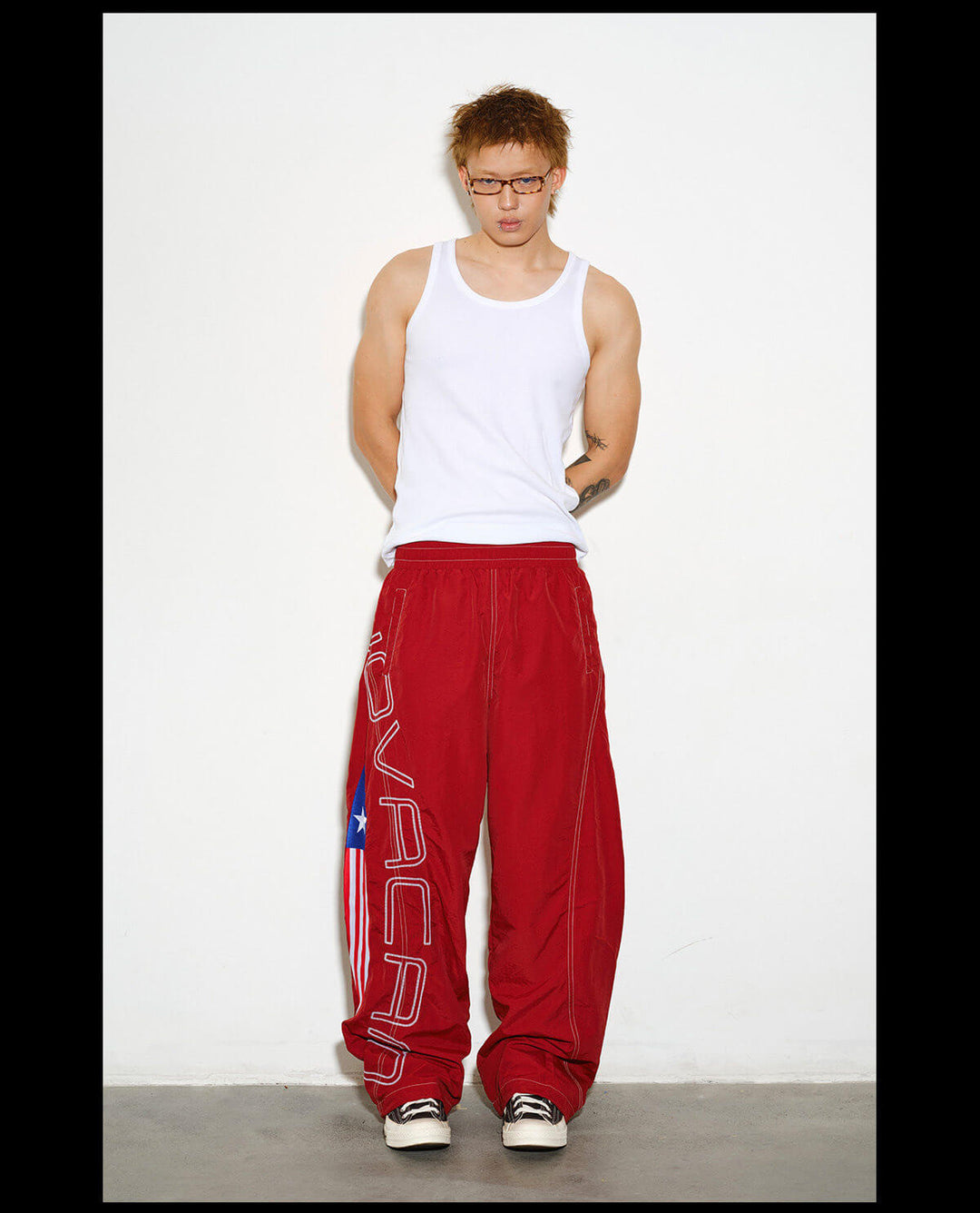 NOVACAM Logo Embroidered Nylon Curved Baggy Track Pants | Face 3 Face
