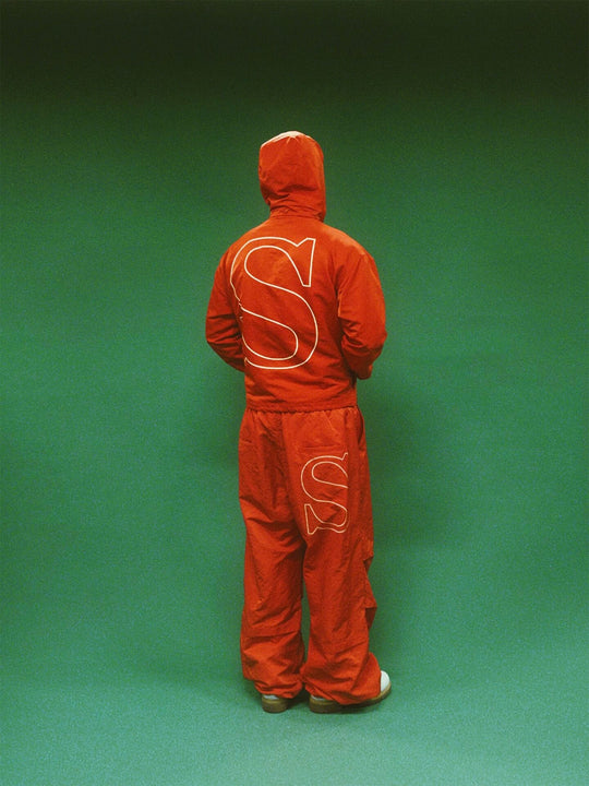 EVETS Orange Logo Print Nylon Baggy Track Pants | Face 3 Face