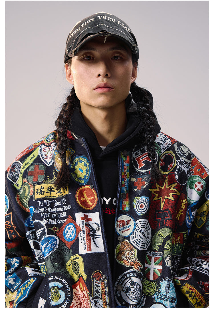 Remedy All Over Badge Print Varsity Jacket | Face 3 Face