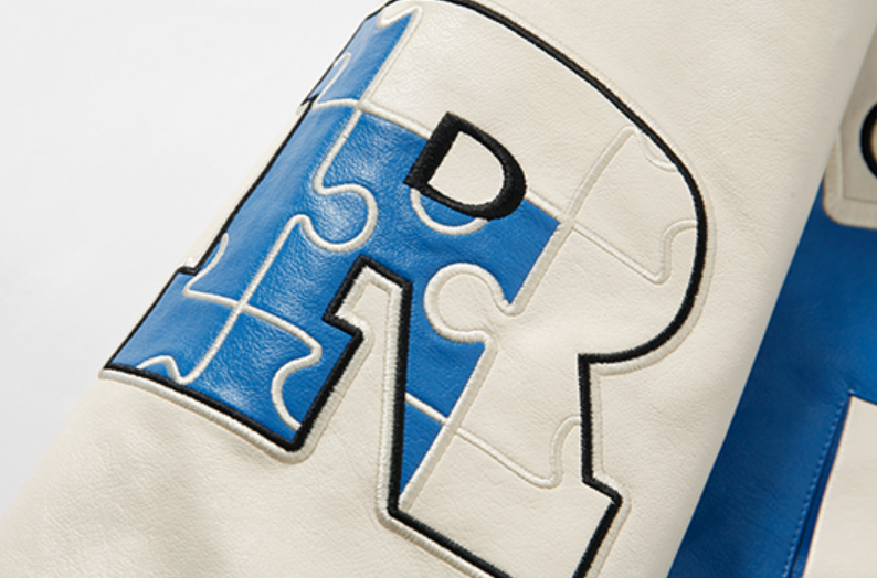 YADcrew X ROOT Puzzle Stitching Leather Varsity Jacket