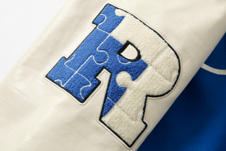 YADcrew X ROOT Puzzle Stitching Varsity Jacket