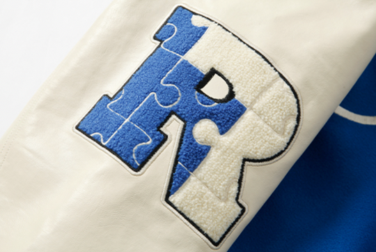 YADcrew X ROOT Puzzle Stitching Varsity Jacket