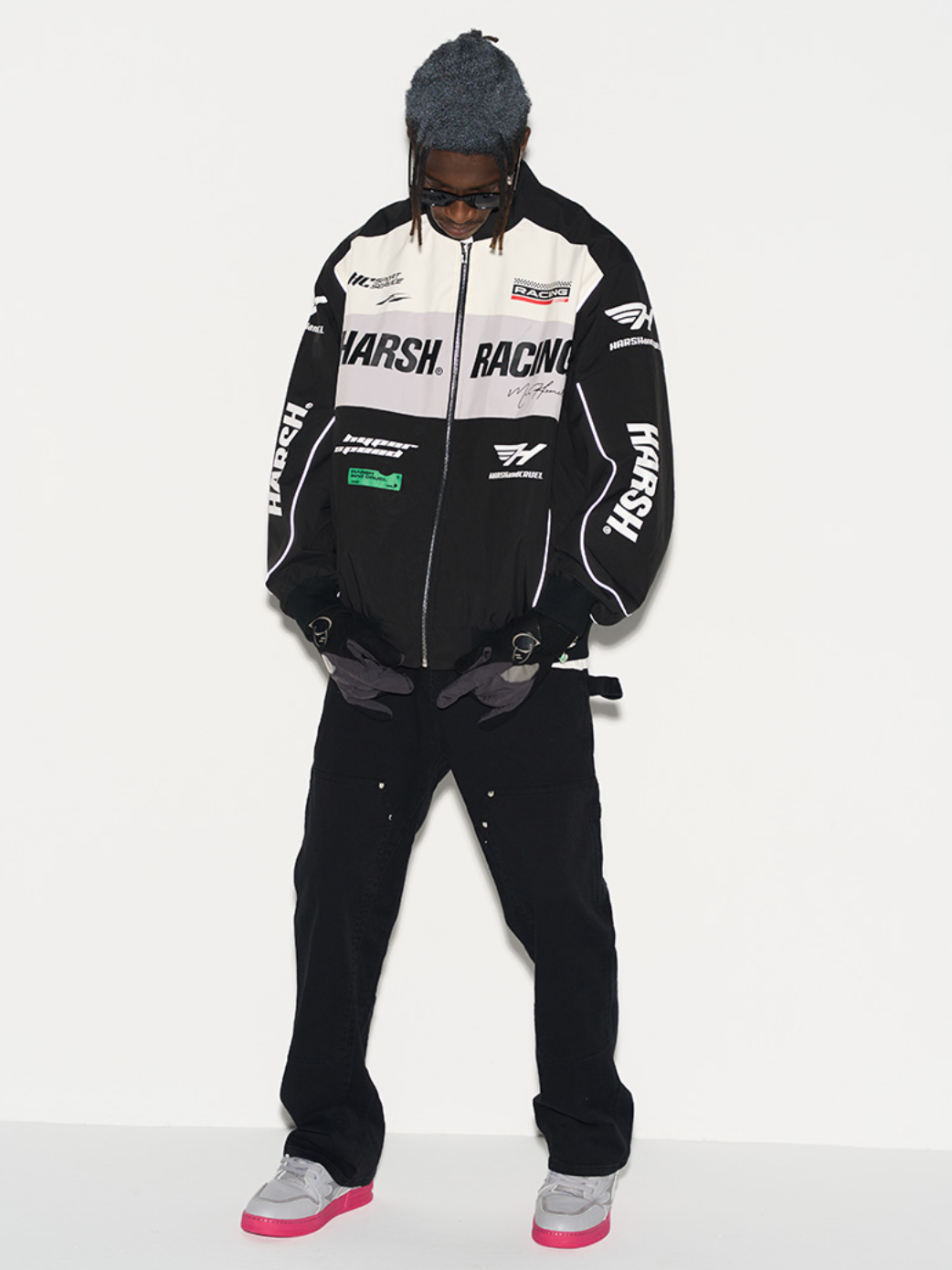 Harsh and Cruel Retro Motorcycle Racing Logo Jacket - This stylish jacket evokes the nostalgic atmosphere and powerful design of classic motorcycle racing. With high-quality materials and a bold logo print, it's a striking statement piece that seamlessly integrates into a street-style wardrobe. Versatile for spring and fall layering, this jacket captures the energy of the racetrack.