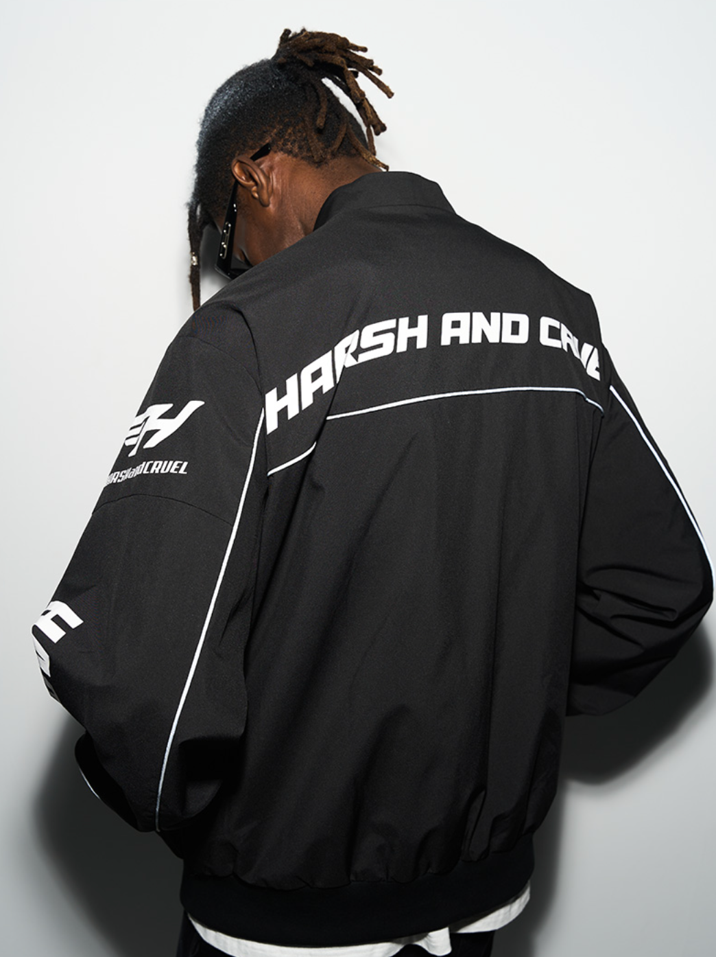 Harsh and Cruel Retro Motorcycle Racing Logo Jacket - This stylish jacket evokes the nostalgic atmosphere and powerful design of classic motorcycle racing. With high-quality materials and a bold logo print, it's a striking statement piece that seamlessly integrates into a street-style wardrobe. Versatile for spring and fall layering, this jacket captures the energy of the racetrack.