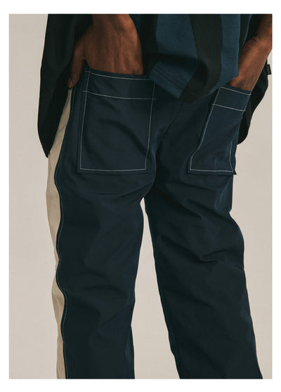 ANTIDOTE Deconstructed Splicing Nylon Zipper Pants